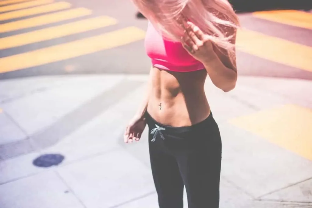 Woman with toned stomach after LA-EMS Body Sculpting Treatment Kilburn